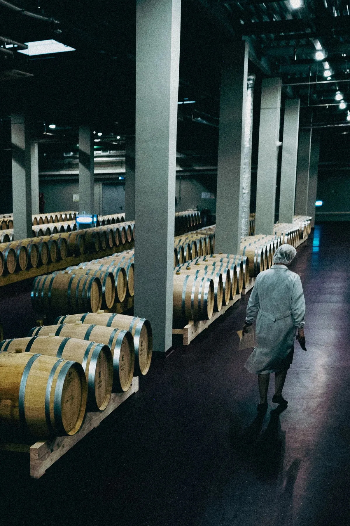 Real barrel warehouse photographed with controlled industrial lighting